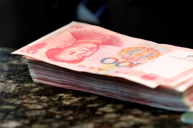 China's central bank says market to play decisive role in yuan exchange rate