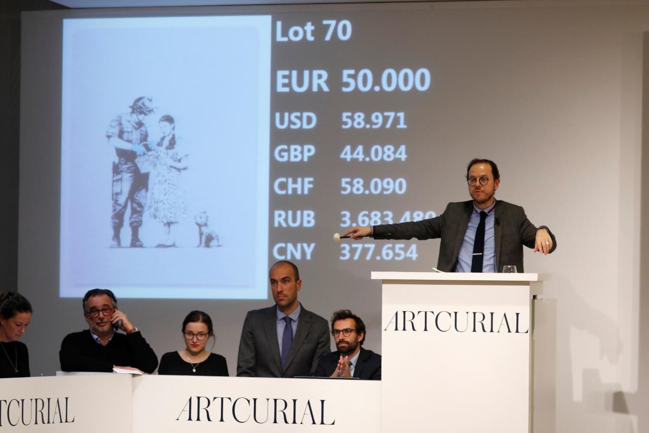 Banksy prints sell intact at stunt-free Paris auction