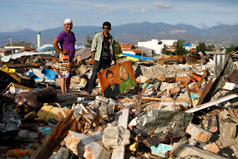 Indonesians seek talismans of former lives in quake rubble