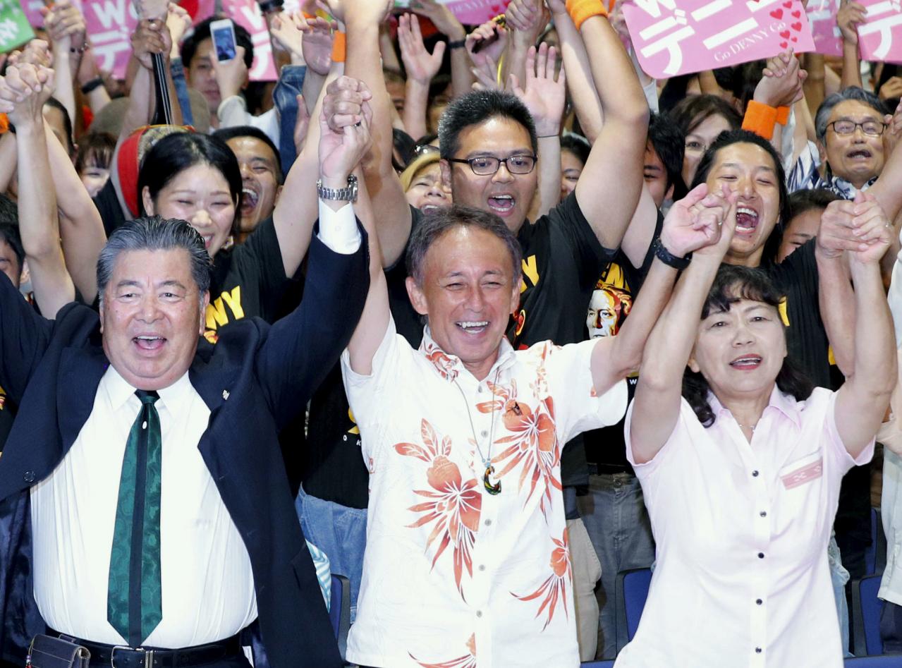 In blow to Japan PM, son of US Marine wins Okinawa governor vote