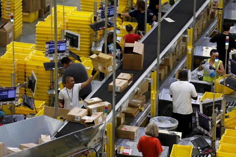 Amazon raises minimum wage to $15, urges rivals to follow