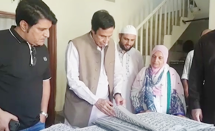 Ch Pervaiz Elahi visits house of woman writing Holy Quran by hand