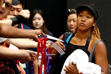 Emotional Osaka battles past Zhang into Beijing semis