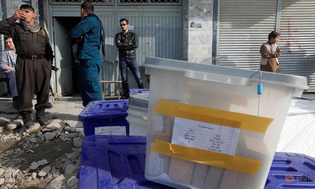 Afghans vote amid chaos, corruption and Taliban threats