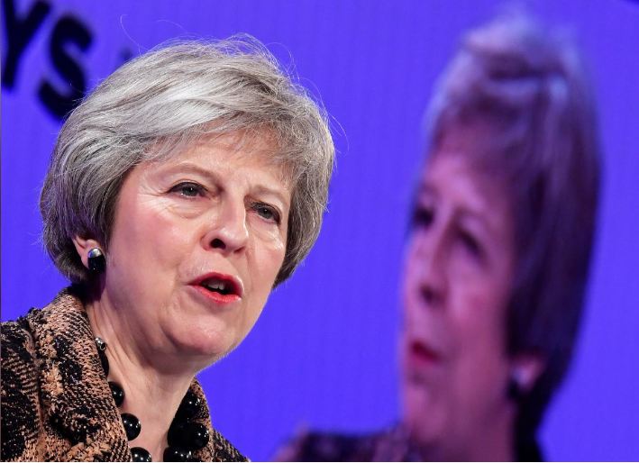 May sticks to Brexit deal as opponents seek formal challenge