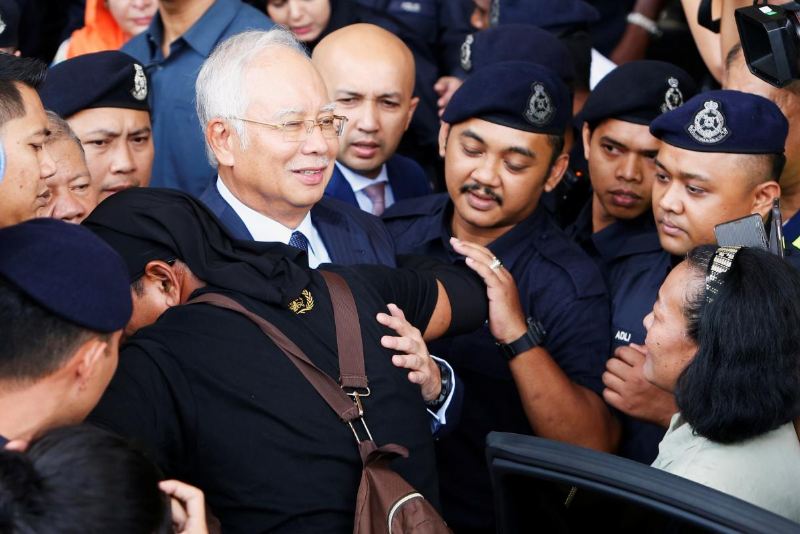 Malaysia reopens submarine probe, questions former PM Najib