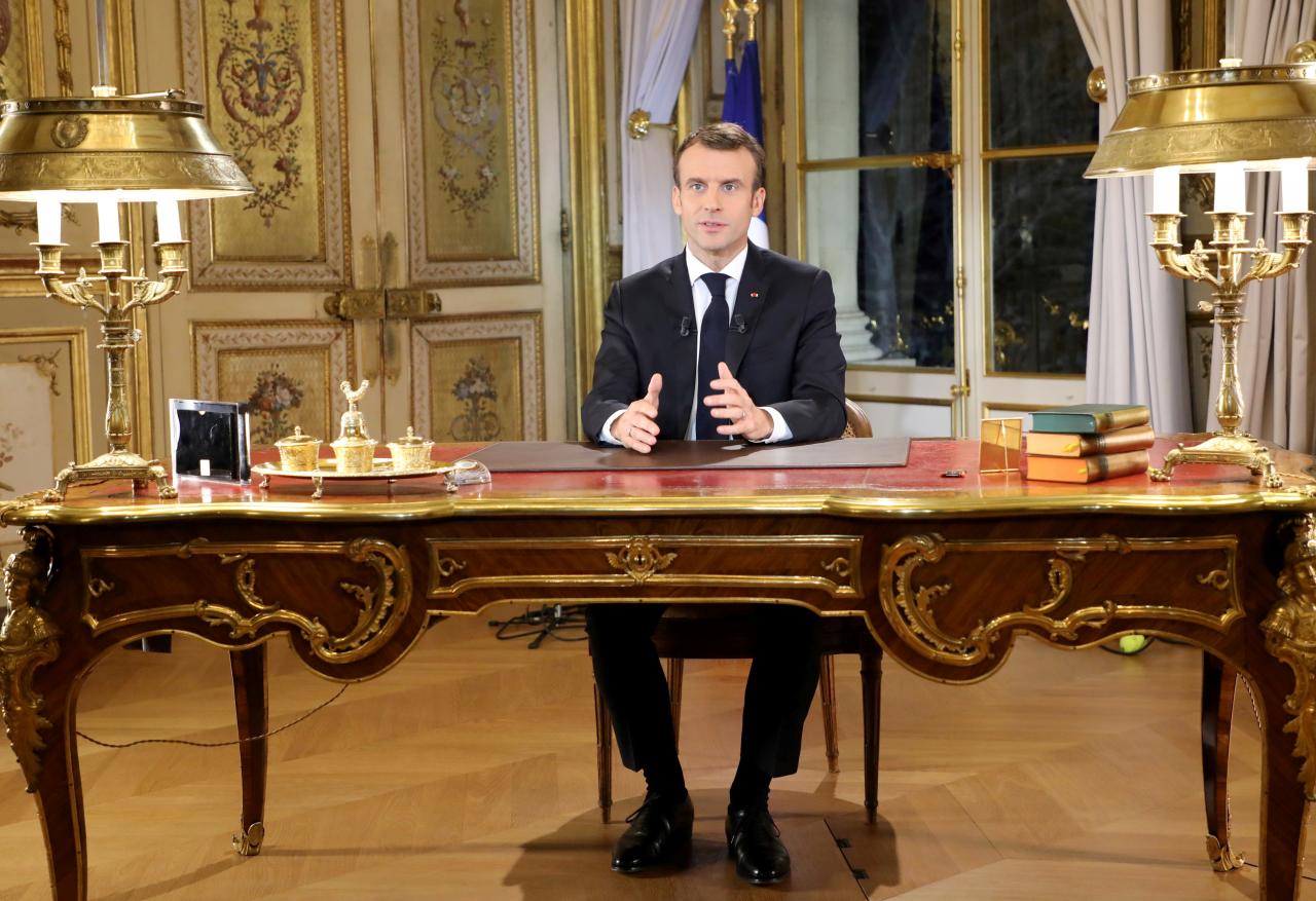 Macron to speed up tax cuts, raise wages at 'historic time' for France