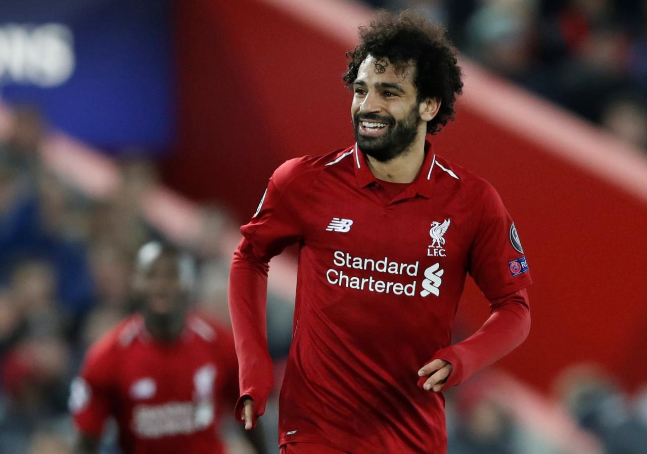 Salah fires Liverpool into Champions League last 16