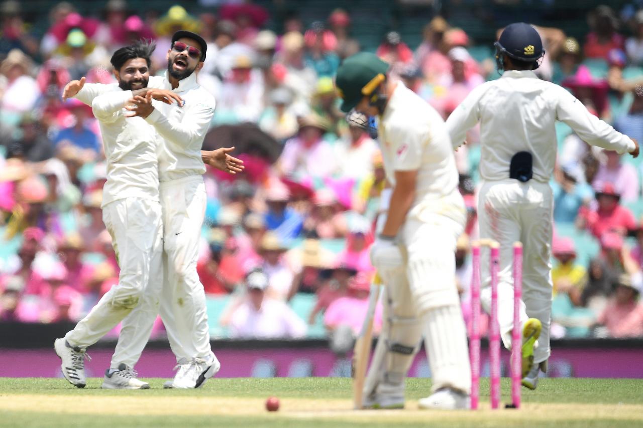 Australia stumble in reply to India's colossal tally