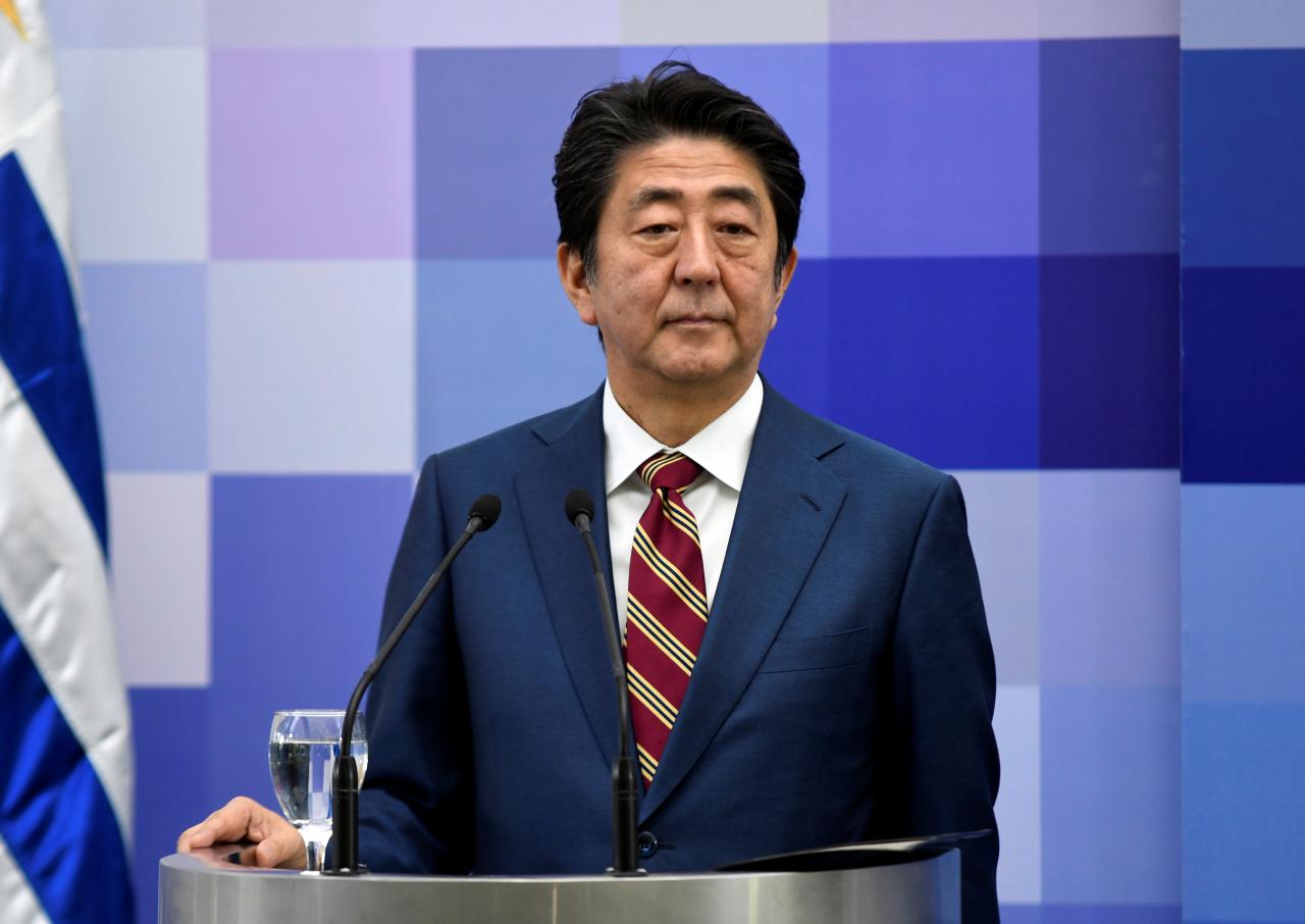 Japan's Abe says vigilant to global economic risks clouding recovery