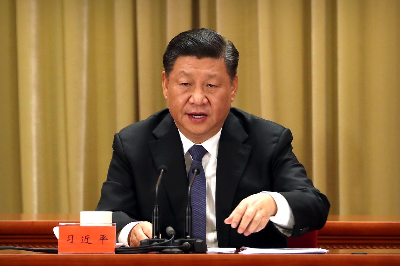 China's Xi urges financial risk prevention while seeking stable growth