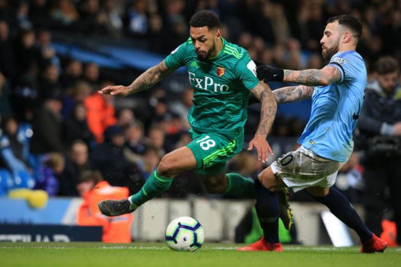 Man City surge clear through Sterling as Spurs suffer