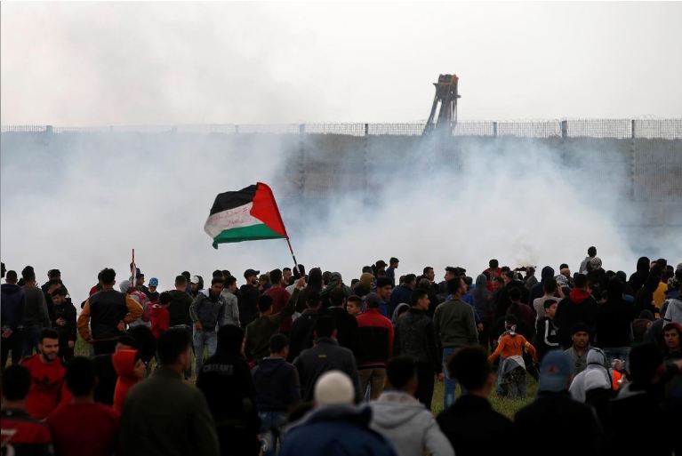 Palestinians mass at Gaza border to mark protest anniversary