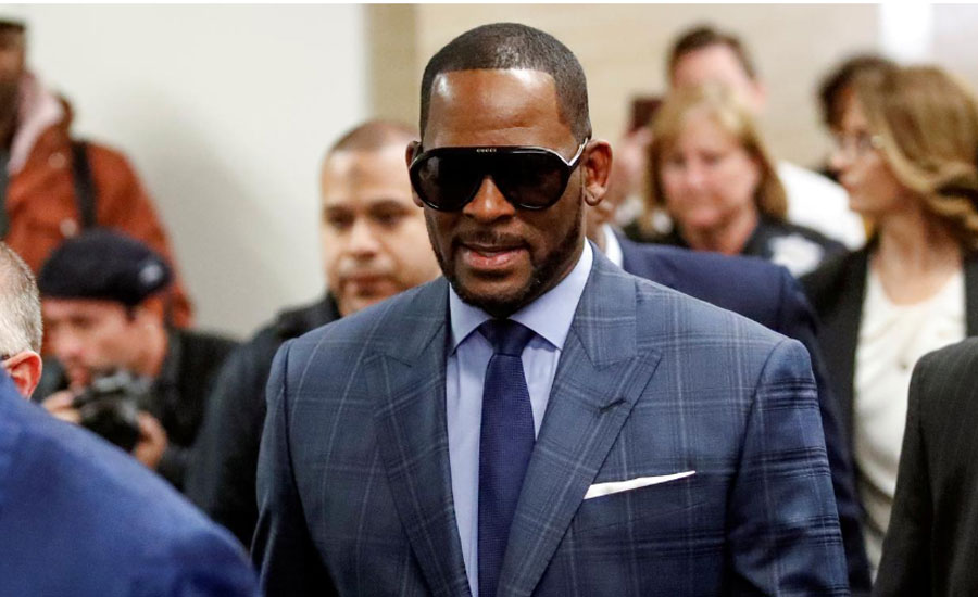 Singer R Kelly charged in Minnesota with soliciting sex from minor