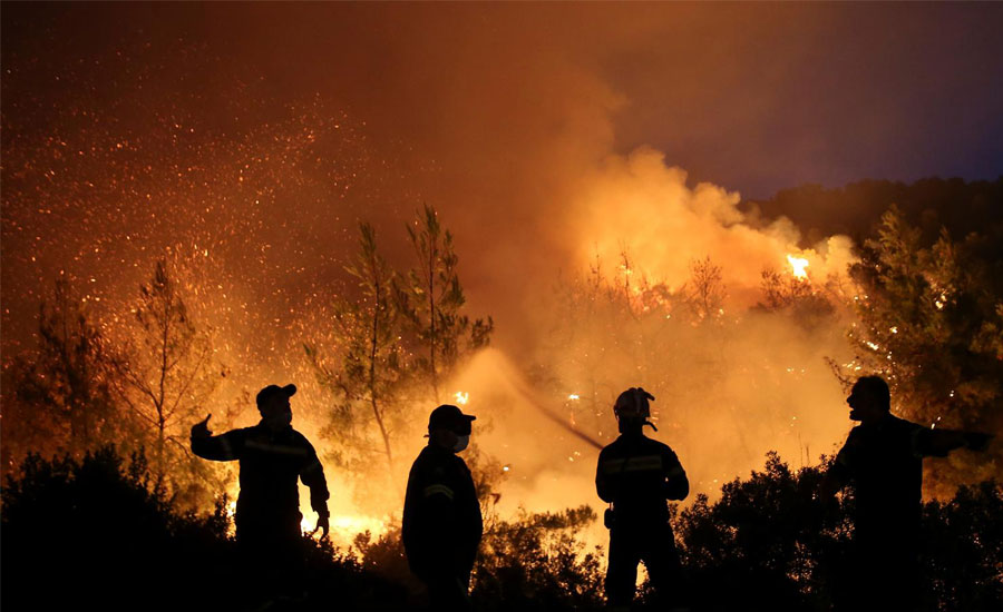 Fire rages on Greece's Evia, threat to people averted