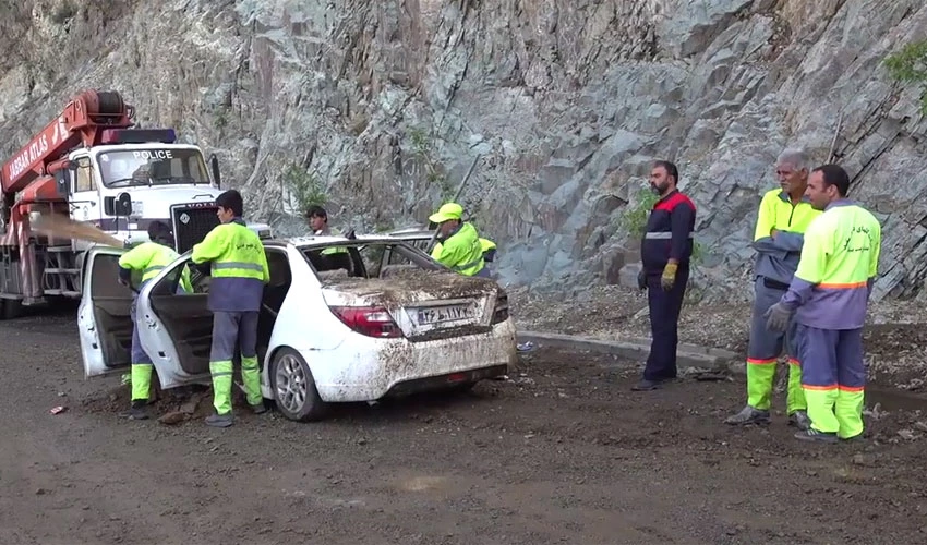 Rescuers search for landslide and flood victims after heavy rain in Iran