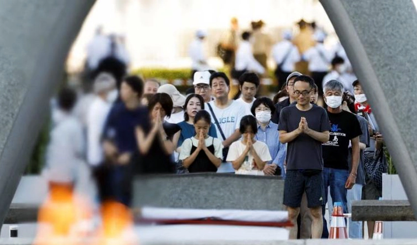 Typhoon forces Japan atomic bomb commemorations inside