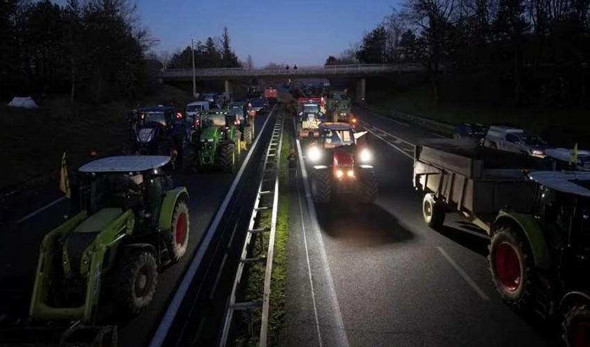 French farmers block highways around Paris as protests reach capital