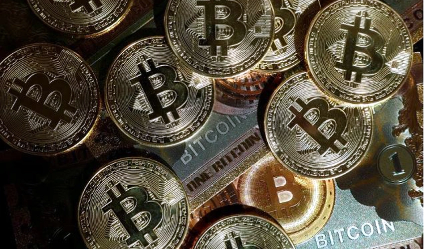 Bitcoin hits record above US$71,000 as demand frenzy intensifies