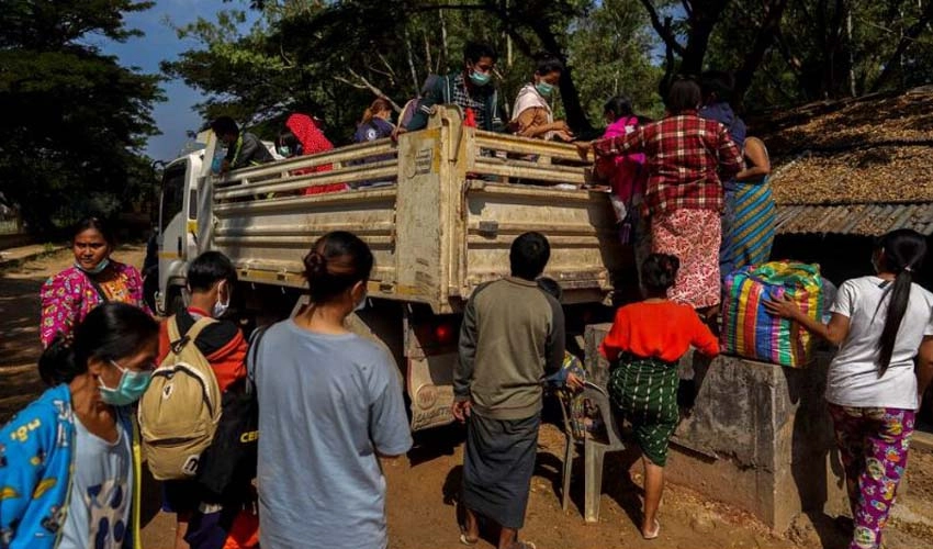 Myanmar border hub residents flee to Thailand amid gunfire, explosions