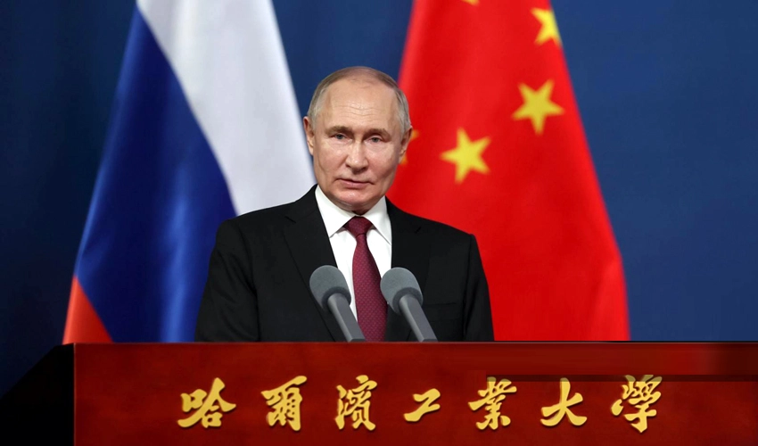 Putin in trade push on final day of China trip