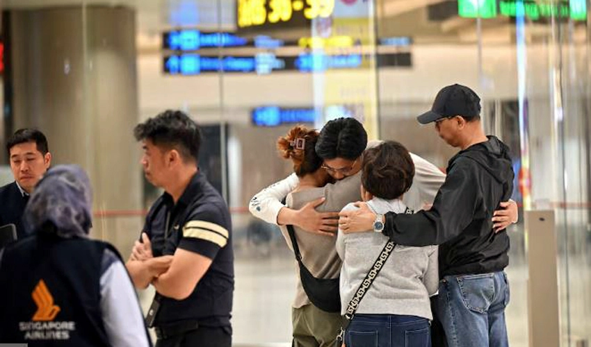 Shaken passengers arrive in Singapore after deadly turbulence-stricken flight