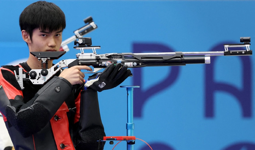 China takes first Olympic gold as rain disrupts Games