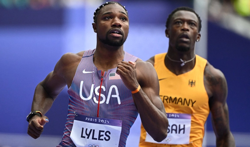 Lyles labours through 100m heat as Olympic boxing row simmers